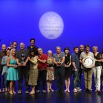 Winning Groups line up with trophies.